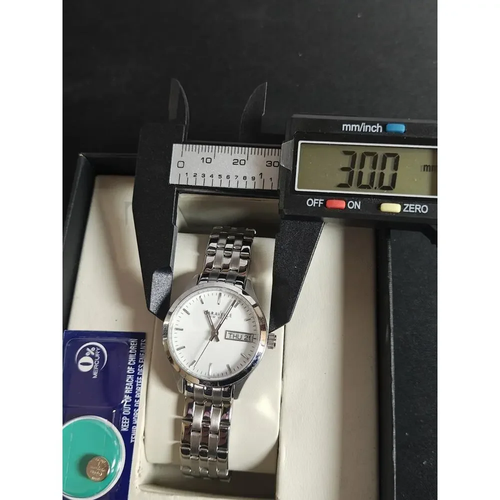 Caravelle by BULOVA 30mm Woman's Corporate Day / Date White Dial Watch NWB